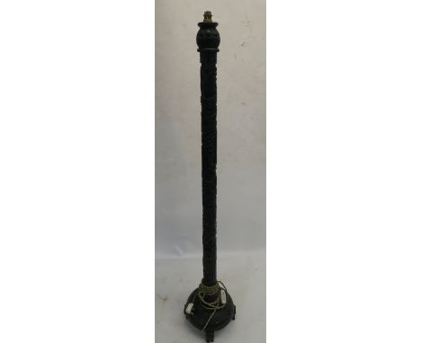 A CHINESE CARVED AND STAINED WOOD STANDARD LAMP decorated with figures amongst trees, 159cm high Condition Report: Available 