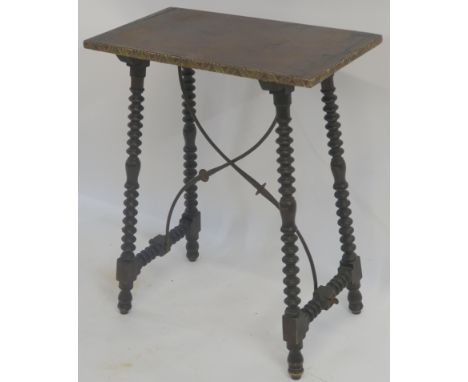 A SPANISH WALNUT SIDE TABLE the rectangular top with carved gilt edge above bobbin turned legs, joined by a wrought iron cros