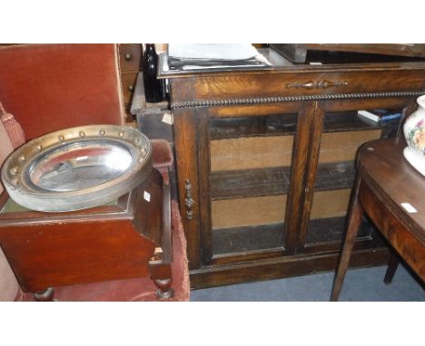 A 1920S OAK GLAZED BOOKCASE, 42" wide, a Regency style gilt framed convex wall mirror and a Victorian step commode 