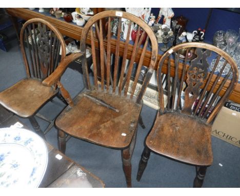 A PAIR OF 19TH CENTURY WINDSOR WHEEL BACK KITCHEN CHAIRS and a similar stick-back armchair (3)