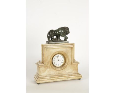 A 19TH CENTURY ONYX CASED MANTEL CLOCK, with white enamel dial surmounted by a carved serpentine lion, 15" high x 13" wide