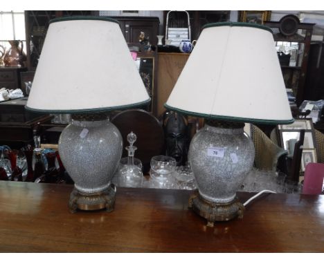 A PAIR OF CRACKLE GLAZED CERAMIC TABLE LAMPS, with gilt metal fittings