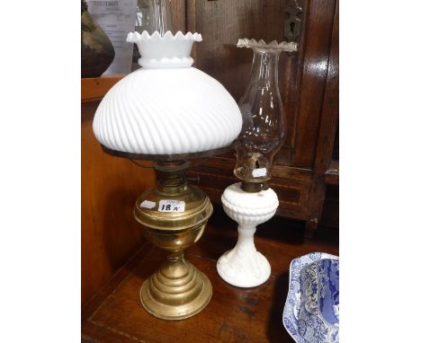 A VICTORIAN STYLE MOULDED GLASS OIL LAMP and a brass oil lamp
