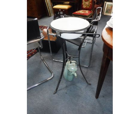 A 19TH CENTURY IRON WASHSTAND with enamel bowl and hot water jug  