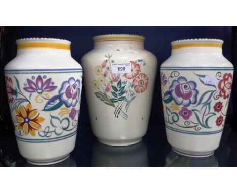 THREE POOLE POTTERY VASES with traditional floral decoration