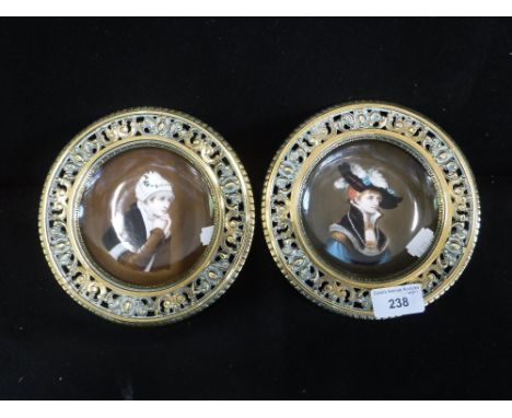 A PAIR OF GERMAN OR SIMILAR SAUCERS in brass mounts