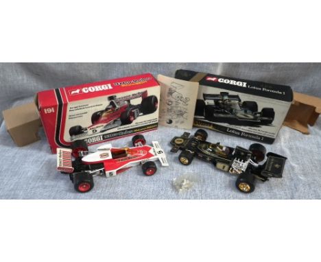 CORGI: A TEXACO-MARLBORO MCLAREN M23F1 DIE-CAST 18: 1 SCALE MODEL (model 191) (boxed) and a Corgi J.P.S. Lotus Formula 1 (mod