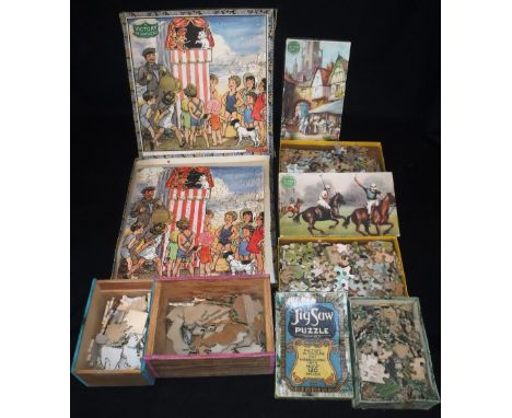 VICTORY: A VINTAGE 1930'S JIGSAW PUZZLE depicting a Punch and Judy Show (with original box), three Chad Valley jigsaw puzzles