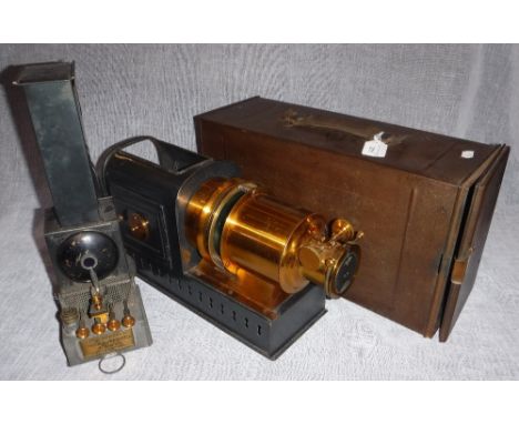 A LATE 19TH CENTURY MAGIC LANTERN, with 'The Improved Stocks - Wrench Lamp, Patent No. 705' with original tin box