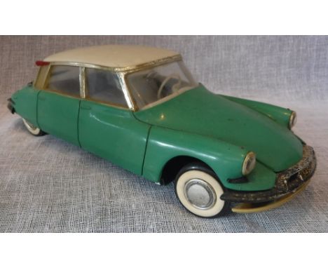 GeGe TOYS OF FRANCE: A LARGE SCALE MODEL of a Citroen DS19 in pale green, with a cream roof 