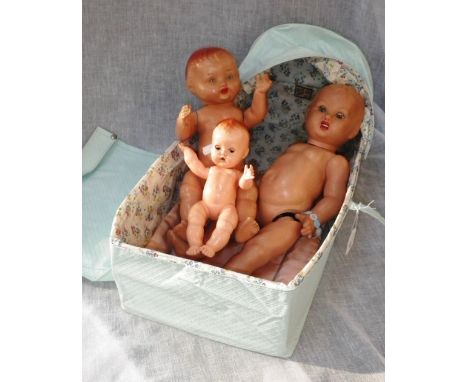 A VINTAGE 'KARR-KOT' containing two 1950's composite jointed dolls and a similar plastic doll
