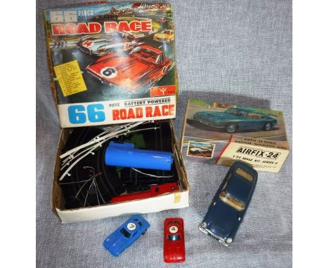 "W T": A VINTAGE 66 PIECE BATTERY OPERATED ROAD-RACE GAME with track and racing cars and a constructed "Airfix" Aston Martin 