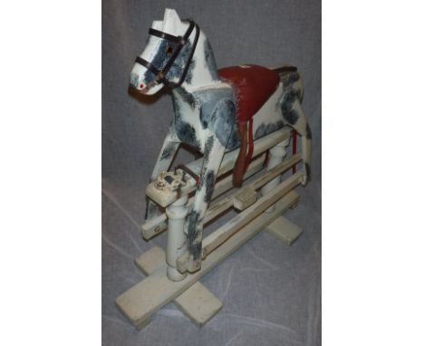 A VINTAGE WOODEN CHILD'S ROCKING HORSE with safety rocker