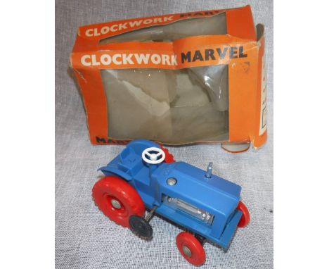 MINIC (A Ti-ang product): A BLUE "Clickity-Click" clockwork tractor (With original, damaged, box)