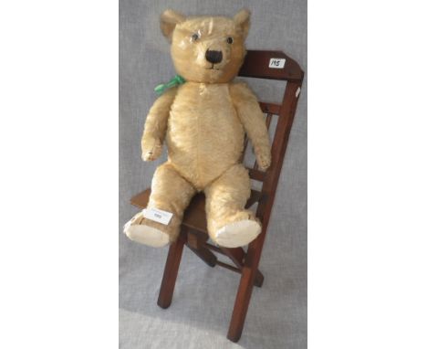 A VINTAGE EARLY 20TH CENTURY PLUSH TEDDY BEAR (with growling voice box, not working) with hardwood folding chair