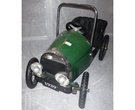 A VINTAGE STYLE GREEN PEDAL CAR by "Great Gizmos Limited" with spoked wheels