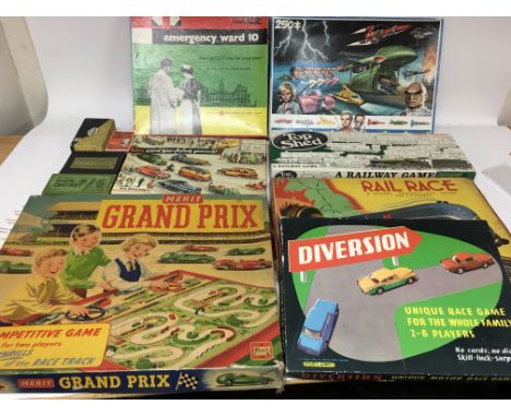 A collection of vintage board games including Emergancy ward 10, Top Shed railway game, Merit Grand Prix, Divertion driving g