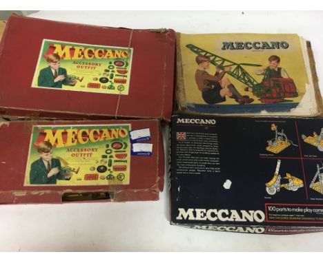 A box containing a collection of Meccano including Accessory outfits and instructions leaflet for outfit 6 etc