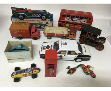 A collection of tinplate toys including Reproduction Schylling racing car, Willow brook Routemaster bus, a Royal Mail deliver