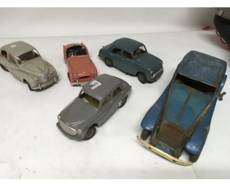 A collection of vintage battery operated vehicles also a tinplate clockwork Rolls Royce