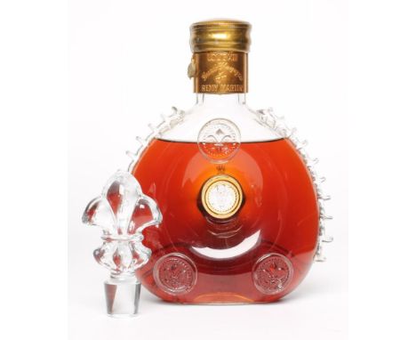One bottle Remy Martin Louis XIII Grand Champagne Cognac in decorated Centaure Baccarat Cristal decanter and fleur de lys sto