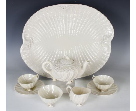 A Belleek Neptune cabaret tea service, second black mark, 1891-1926, shell shaped with some light yellow colouring, comprisin