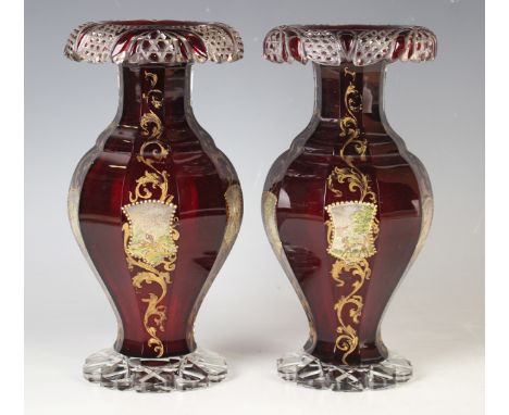A pair of ruby flashed cut glass vases, probably Bohemian, late 19th/early 20th century, of decagonal baluster shape, alterna