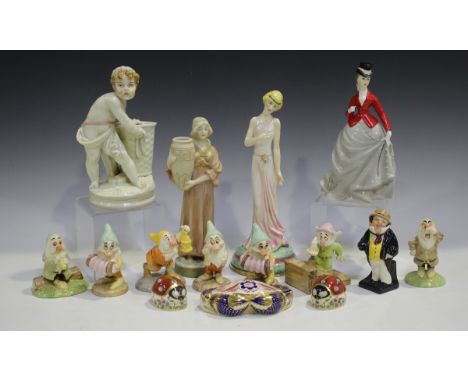 A mixed group of decorative ceramics, including a Royal Worcester figure of a boy with a wicker basket, late 19th century, he