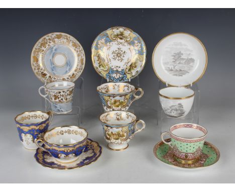 A collection of English porcelain cups and saucers, 19th century, including a Spode bute shaped teacup and saucer, both print