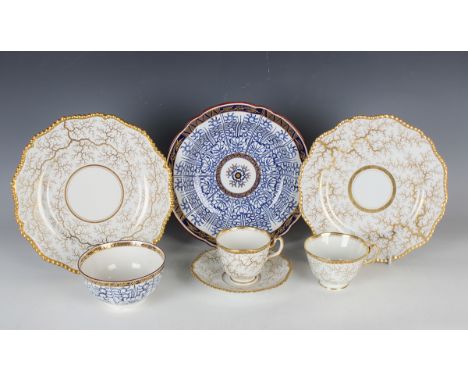 A Flight, Barr Barr Worcester trio, circa 1815-20, gilt with a seaweed pattern beneath a gadrooned rim, together with two mat