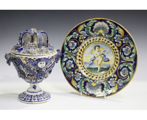 A Dutch tile, 17th century, painted in underglaze blue, ochre and green with three central tulips within stylized detail to t