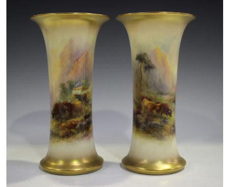 A pair of Royal Worcester vases, circa 1926, painted by H. Stinton, signed, the flared cylindrical bodies with Highland cattl