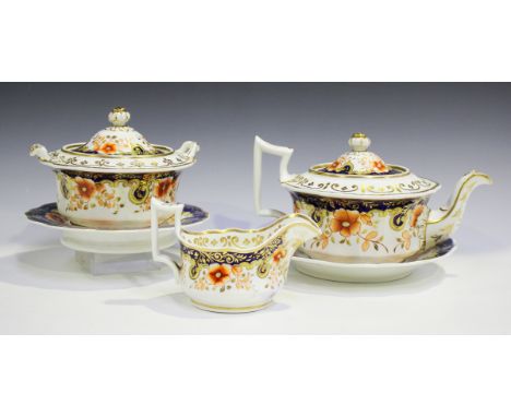 A Ridgway part tea service, early 19th century, decorated with iron red floral sprays within cobalt blue and gilt scroll bord