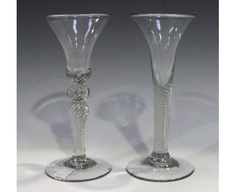 Two multiple spiral airtwist stem soda wine glasses, late 18th century, the first with trumpet bowl above the plain stem and 