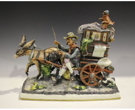 A large Capodimonte porcelain figure group depicting an organ grinder with his monkey and donkey, length 41cm, together with 