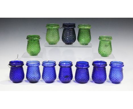 Twelve late Victorian coloured glass night light holders, each with cross hatched moulded body, height 9cm, together with a s