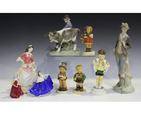 A Royal Copenhagen model of a boy with a calf, circa 1962, modelled by Christian Thomson, height 16.5cm, together with a smal