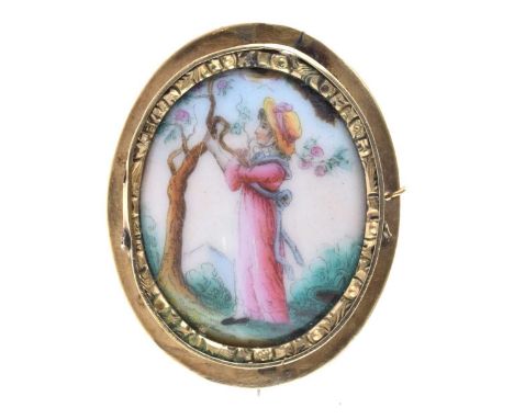 Ceramic panel brooch, the oval panel with a Kate Greenaway-style female figure, 5cm long
