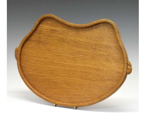 Workshop of Robert 'Mouseman' Thompson, late 20th Century English oak kidney-shaped tray with adzed surface and two carved mo