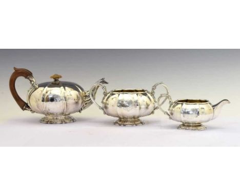 George IV silver three-piece silver tea set of melon-shaped form, comprising, teapot, sugar bowl, and milk jug, sponsors mark