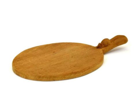 Workshop of Robert 'Mouseman' Thompson, late 20th Century English oak oval cheese board with adzed surface and carved mouse s