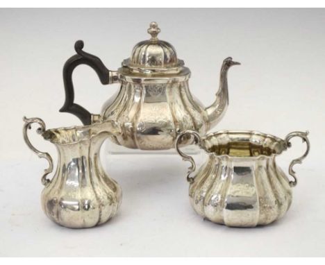 Victorian bachelor's silver three-piece tea set of pear shape in the Queen Anne style, comprising teapot, cream jug and sugar