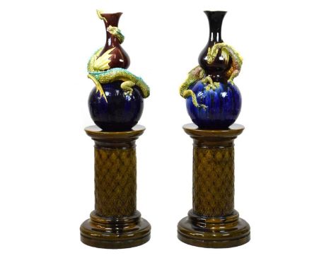 Burmantofts – Pair of large Faience ‘Dragon’ vases and pedestals, of double gourd form with flared collar neck, shape number 