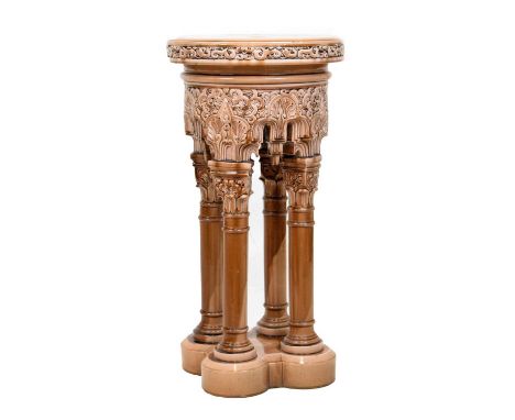 Late Victorian art pottery moulded and faun glazed pedestal of Moorish influence, the circular top with moulded stylised bord