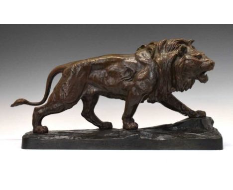 After Paul Thomas (1859-1910) - 'Lion qui marche / Lion marchant', a large bronze figure of a stalking lion, possibly cast by