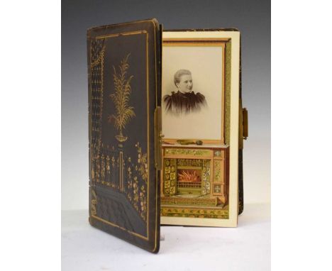 Late Victorian leather bound album with gilt metal mounts, the front cover stamped and gilded with an interior scene, alterna