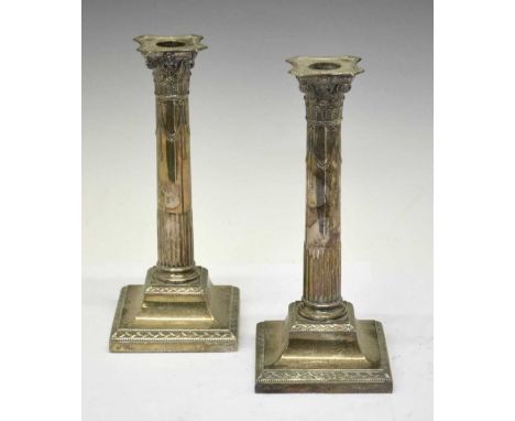 Pair of George V silver column candlesticks of Corinthian form with Adam style classical decoration, sponsors mark of Hawkswo