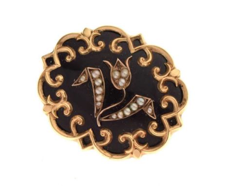 Victorian mourning brooch, in black enamel with a seed pearl set floral motif, locket back mounted with plaited hair, 4cm wid