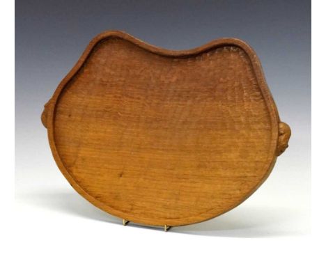 Workshop of Robert 'Mouseman' Thompson, late 20th Century English oak kidney-shaped tray with adzed surface and two carved mo