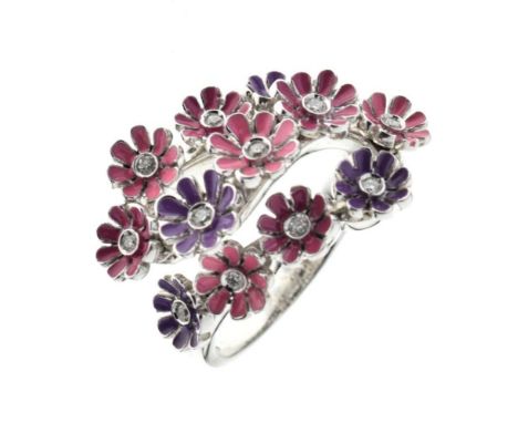 Diamond kinetic enamel flowerhead ring, the white mount stamped '750', the head composed of thirteen flowerheads enamelled ei